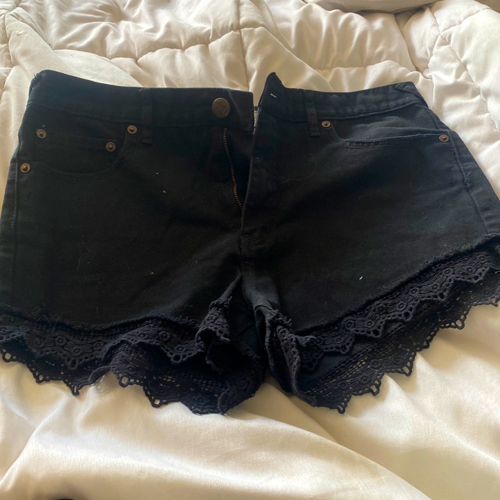 Free People black stretchy jean shorts with lace